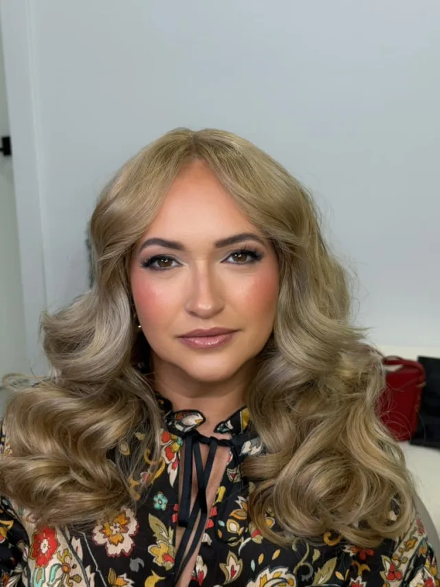 Natural glam with soft pink lips and voluminous curls